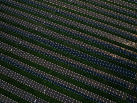 Aerial view of rows of solar panels installed on green fields for renewable energy production in Augusta Sicily Italy. Aerial view of rows of solar panels installed on green fields for renewable energy production in Augusta Sicily Italy.