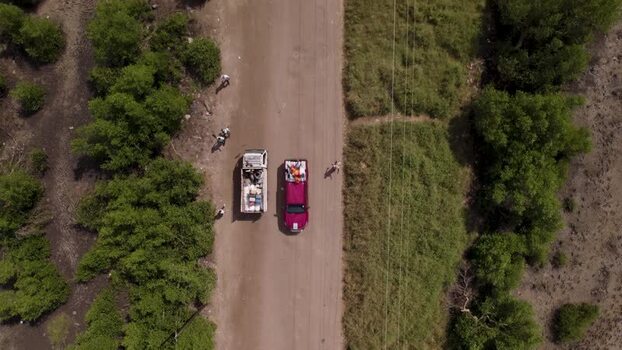 Aerial view of vehicle and cyclist on road Mozambique.