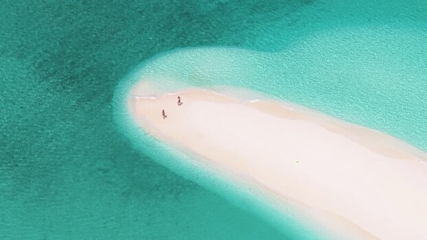 Aerial view of people walking on a tropical sandbar Maldives. Aerial view of people walking on a tropical sandbar Maldives.