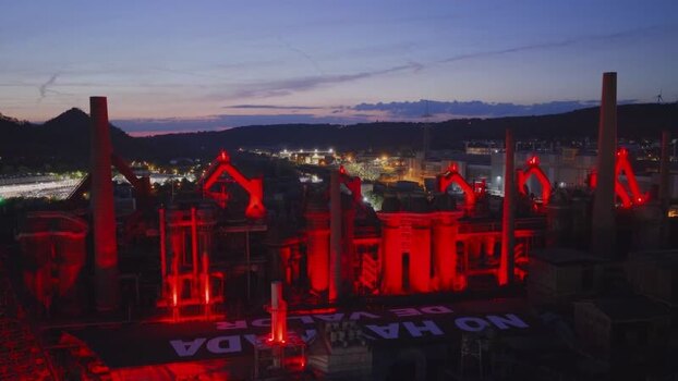 Aerial view of Volklingen Ironworks with red lights at dusk Germany. Aerial view of Volklingen Ironworks with red lights at dusk Germany.