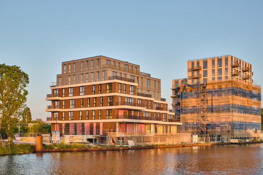 Alkmaar Netherlands 11 May 2026 View of modern apartment buildings under construction along the Alkmaar Kanaal in the Overstad redevelopment zone during golden hour. Alkmaar Netherlands 11 May 2026 View of modern apartment buildings under construction along the Alkmaar Kanaal in the Overstad redevelopment zone during golden hour.