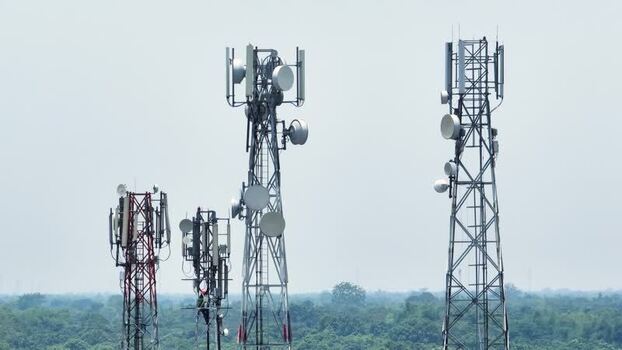 Aerial view of telecommunication towers over a forest. Aerial view of telecommunication towers over a forest.