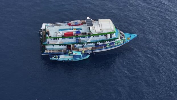 Aerial view of a safari boat and support vessel Maldives. Aerial view of a safari boat and support vessel Maldives.