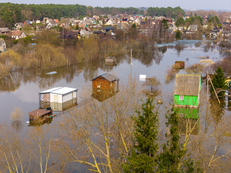 Kedainiai Lithuania 17 March 2026 Aerial view of flooded houses and gardens surrounded by rising river water near a forest. Kedainiai Lithuania 17 March 2026 Aerial view of flooded houses and gardens surrounded by rising river water near a forest.