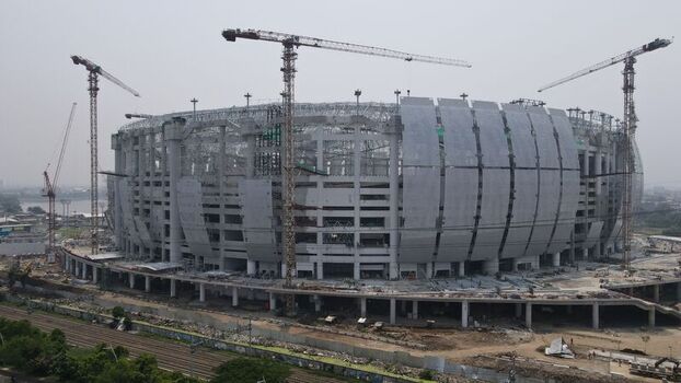 Aerial view of the Jakarta International Stadium under construction with multiple cranes and steel structures in Tanjung Priok Jakarta Indonesia. Aerial view of the Jakarta International Stadium under construction with multiple cranes and steel structures in Tanjung Priok Jakarta Indonesia.