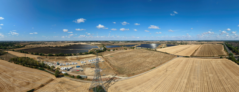 Aerial view of the Eaton Socon Substation solar farm and battery energy storage systems surrounded by agricultural fields in St. Neots England United Kingdom. Aerial view of the Eaton Socon Substation solar farm and battery energy storage systems surrounded by agricultural fields in St. Neots England United Kingdom.
