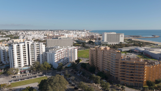 Aerial view of Vilamoura and Quarteira featuring modern hotel architecture coastal buildings and the Atlantic Ocean coastline in Quarteira Faro District Portugal.