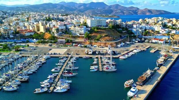 Aerial view of marina with sailboats and yachts in Crete Greece.