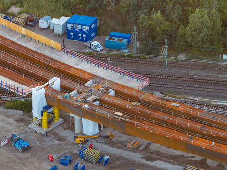 Aerial view of the Ringbahnbrucke bridge construction at the Funkturm interchange featuring steel girders construction equipment and railway tracks in Berlin Berlin Germany. Aerial view of the Ringbahnbrucke bridge construction at the Funkturm interchange featuring steel girders construction equipment and railway tracks in Berlin Berlin Germany.