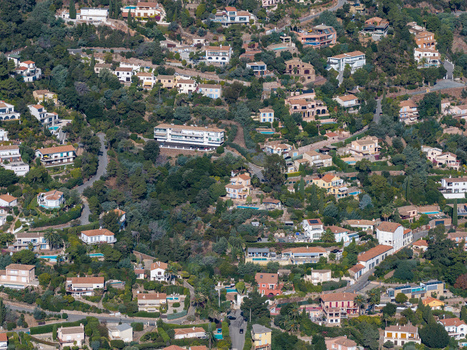Aerial view of Le Trayas a hillside residential area with villas nestled among dense Mediterranean greenery and winding roads in Saint Raphael Provence Alpes Cote d Azur France. Aerial view of Le Trayas a hillside residential area with villas nestled among dense Mediterranean greenery and winding roads in Saint Raphael Provence Alpes Cote d Azur France.