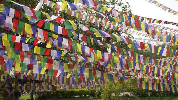 View of colorful prayer flags hanging in Lumbini Nepal.