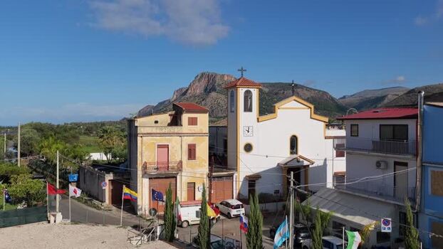 Aerial view of Borgo Parrini church and colorful buildings Italy.