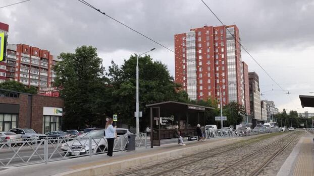 View of a tram stop and residential buildings in Kaliningrad Russia.
