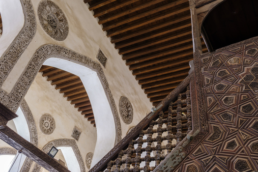 View of the Mosque of al Salih Tala i with intricate wood carvings and decorative stone arches Cairo Egypt. View of the Mosque of al Salih Tala i with intricate wood carvings and decorative stone arches Cairo Egypt.
