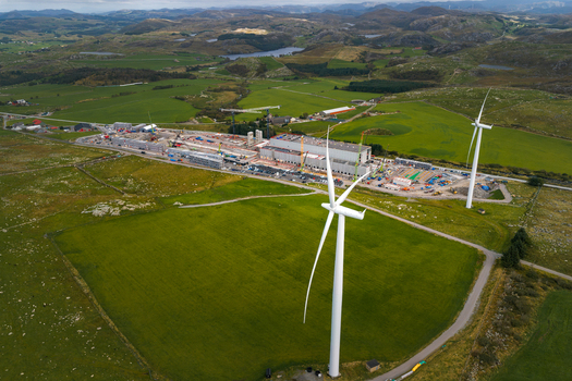 Aerial view of Green Mountain SVG Undheim data center construction site with wind turbines cranes and industrial buildings set in the rural landscape of Undheim Rogaland Norway. Aerial view of Green Mountain SVG Undheim data center construction site with wind turbines cranes and industrial buildings set in the rural landscape of Undheim Rogaland Norway.