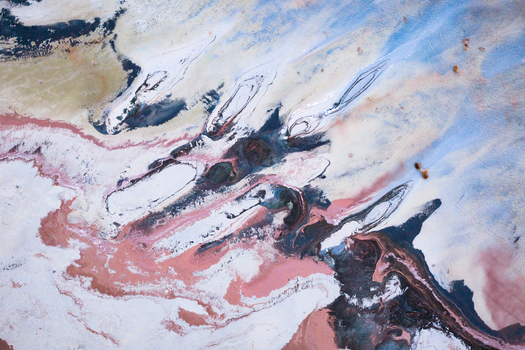 Aerial view of swirling hues of white pink brown and blue creating an abstract earth painting Salt Lake City Utah United States. Aerial view of swirling hues of white pink brown and blue creating an abstract earth painting Salt Lake City Utah United States.