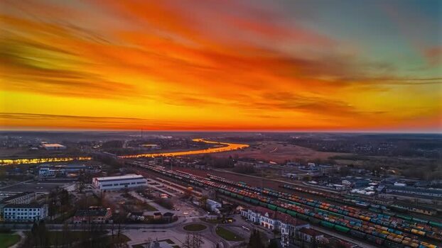 Aerial view of railway yard with freight trains at sunset Latvia. Aerial view of railway yard with freight trains at sunset Latvia.
