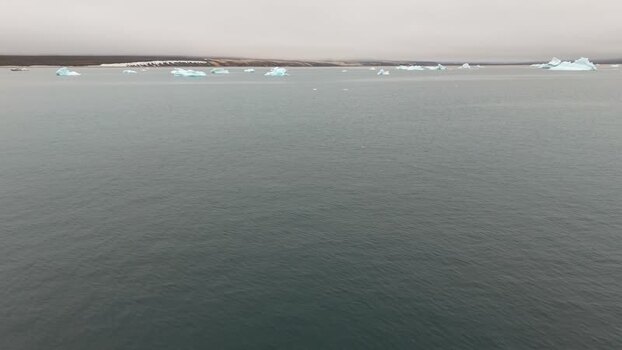 Aerial view of icebergs floating near Disko Island Greenland. Aerial view of icebergs floating near Disko Island Greenland.