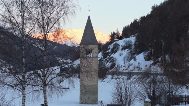 Aerial view of the historic bell tower in Graun im Vinschgau Italy. Aerial view of the historic bell tower in Graun im Vinschgau Italy.