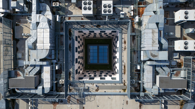 Aerial view of a geometric dance of industrial architecture and checkerboard patterns a rooftop oasis in the heart of the city Bydgoszcz Województwo kujawsko pomorskie Poland. Aerial view of a geometric dance of industrial architecture and checkerboard patterns a rooftop oasis in the heart of the city Bydgoszcz Województwo kujawsko pomorskie Poland.