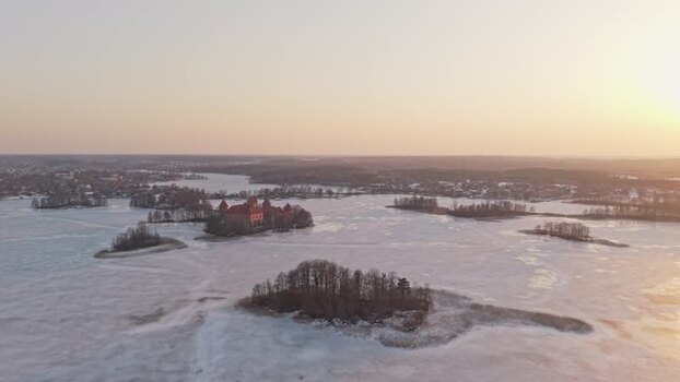 Aerial view of Trakai Castle on frozen lake Lithuania.