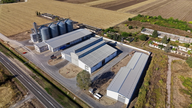Aerial view of storage silo Bavaniste with adjacent warehouses and grain silos surrounded by agricultural fields in Bavaniste Vojvodina Serbia.