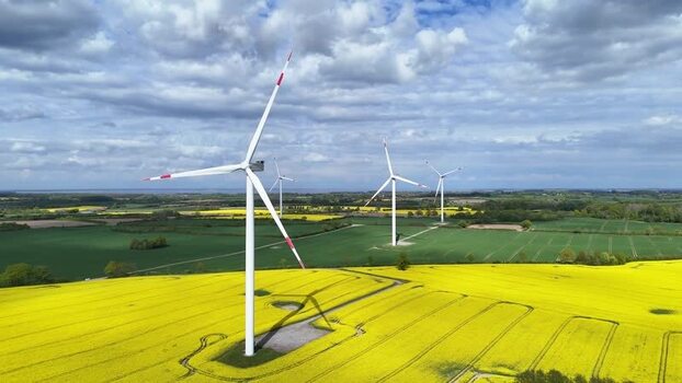 Aerial view of wind turbines in rapeseed fields Germany. Aerial view of wind turbines in rapeseed fields Germany.