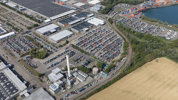 Worth am Rhein Rheinland Pfalz Germany 19 September 2026 Aerial view of the Mercedes Benz Werk Worth industrial complex with rows of parked trucks factory buildings and railway tracks.