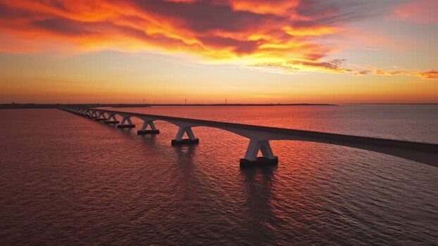 Aerial view of Zeeland Bridge at sunset Netherlands.
