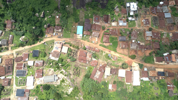 Aerial view of Idanre Hill showing the village with traditional houses dirt roads and lush green vegetation in Idanre Ondo State Nigeria. Aerial view of Idanre Hill showing the village with traditional houses dirt roads and lush green vegetation in Idanre Ondo State Nigeria.