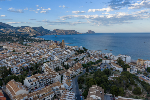 Aerial view of the historic town of Altea with its iconic blue domed church white washed buildings and coastal setting along the Mediterranean Sea in Altea Valencian Community Spain.