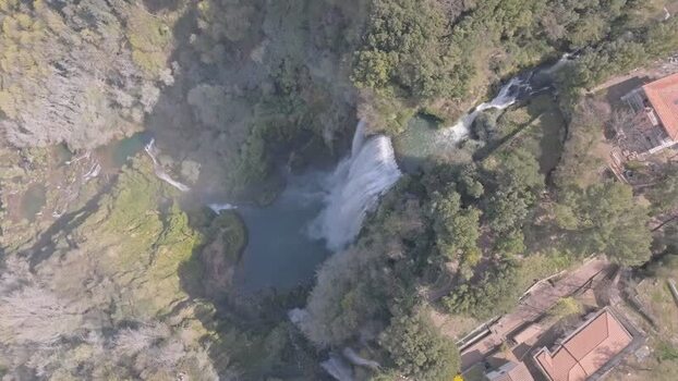 Aerial view of Marmore Falls in the lush Umbrian forest Italy.