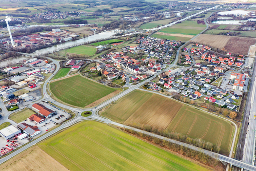 Aerial view of the town of Forchheim featuring residential neighborhoods vast agricultural fields industrial areas and the river landscape in Forchheim Bavaria Germany. Aerial view of the town of Forchheim featuring residential neighborhoods vast agricultural fields industrial areas and the river landscape in Forchheim Bavaria Germany.
