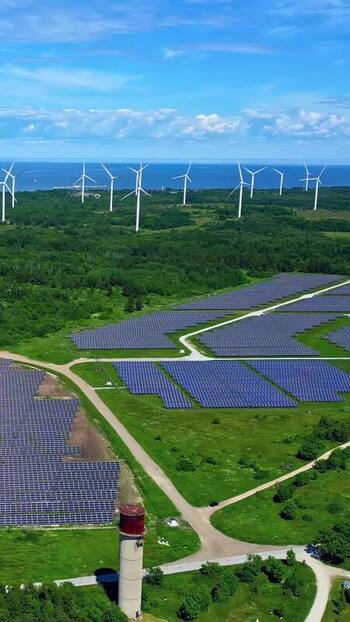 Aerial view of solar farm and wind turbines in Estonia. Aerial view of solar farm and wind turbines in Estonia.