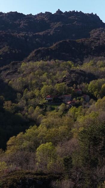 Aerial view of village surrounded by forested landscape peacefull retreat in Portugal. Aerial view of village surrounded by forested landscape peacefull retreat in Portugal.