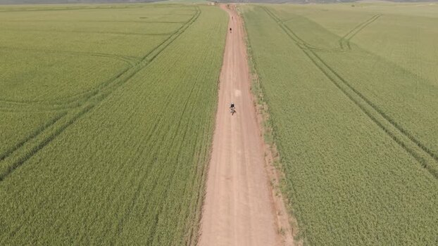 Aerial view of a cyclist on a dirt road in Greyton South Africa. Aerial view of a cyclist on a dirt road in Greyton South Africa.