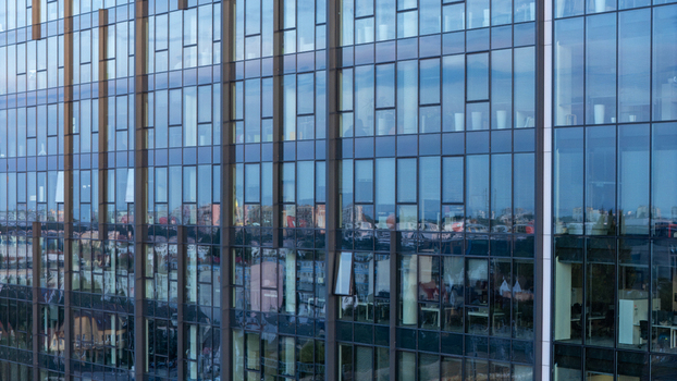 Aerial view of the modern glass facade of an office building in Gdansk Poland. Aerial view of the modern glass facade of an office building in Gdansk Poland.