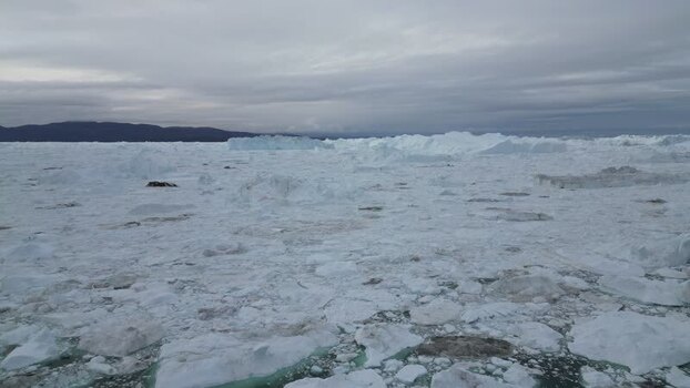 Aerial view of massive icebergs in the Ilulissat Icefjord Greenland. Aerial view of massive icebergs in the Ilulissat Icefjord Greenland.