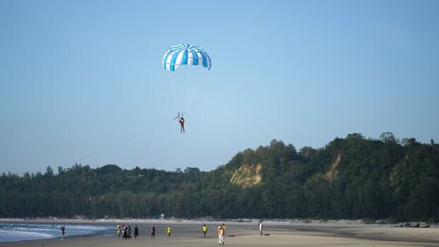 View of a person parasailing over Cox s Bazar beach Bangladesh. View of a person parasailing over Cox s Bazar beach Bangladesh.