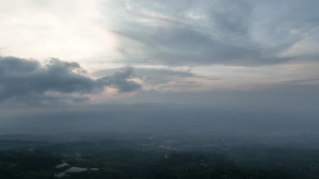 Aerial view of misty hills and mountains in Indonesia. Aerial view of misty hills and mountains in Indonesia.