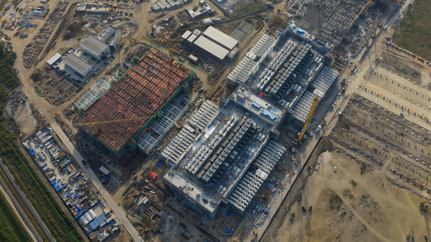 Aerial view of the Bridge Data Center under construction with industrial buildings and cooling units in Khlong Tamru Chon Buri Thailand. Aerial view of the Bridge Data Center under construction with industrial buildings and cooling units in Khlong Tamru Chon Buri Thailand.
