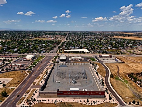 Aerial view of an electrical substation surrounded by suburban roads and residential neighborhoods in Thornton Colorado United States. Aerial view of an electrical substation surrounded by suburban roads and residential neighborhoods in Thornton Colorado United States.
