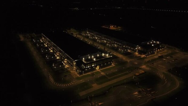Aerial view of data center at night in the Netherlands. Aerial view of data center at night in the Netherlands.