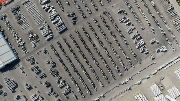 Aerial view of neat rows of concrete blocks and construction materials organized in an industrial storage yard under bright daylight Oosterhout North Brabant Netherlands. Aerial view of neat rows of concrete blocks and construction materials organized in an industrial storage yard under bright daylight Oosterhout North Brabant Netherlands.