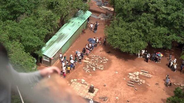 View of tourists queuing at the base of Sigiriya Rock Sri Lanka.
