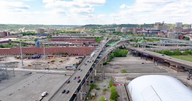 Aerial view of a highway interchange and urban skyline United States. Aerial view of a highway interchange and urban skyline United States.