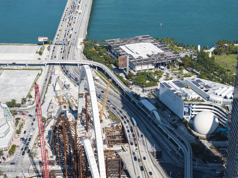Aerial view of the Adrienne Arsht Center the Perez Art Museum and the MacArthur Causeway shimmering in the bright sunlight Miami Florida USA. Aerial view of the Adrienne Arsht Center the Perez Art Museum and the MacArthur Causeway shimmering in the bright sunlight Miami Florida USA.