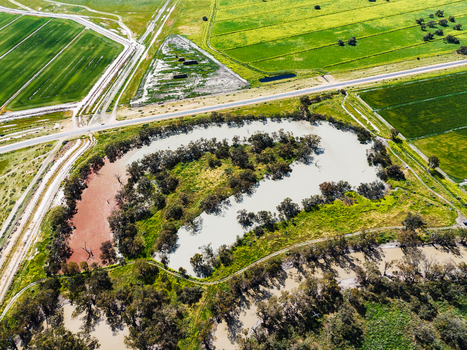 Aerial view of the winding river system and surrounding agricultural fields in the rural landscape of Moulamein New South Wales Australia. Aerial view of the winding river system and surrounding agricultural fields in the rural landscape of Moulamein New South Wales Australia.