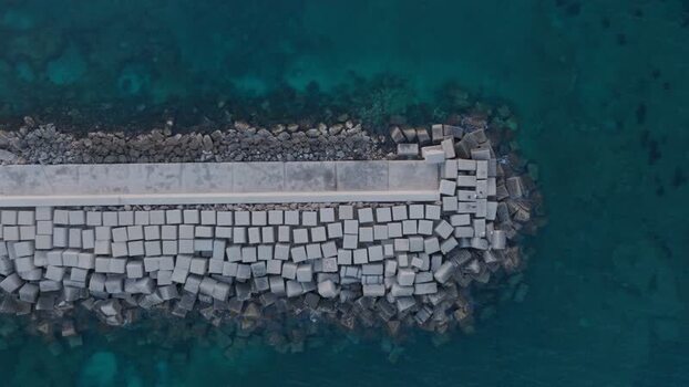 Aerial view of a stone breakwater on the Island of Ortigia Italy. Aerial view of a stone breakwater on the Island of Ortigia Italy.