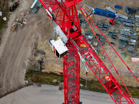 Aerial view of a red tower crane at the Heizkraftwerk Reuter West power plant site during its conversion to renewable energy in Berlin Berlin Germany.